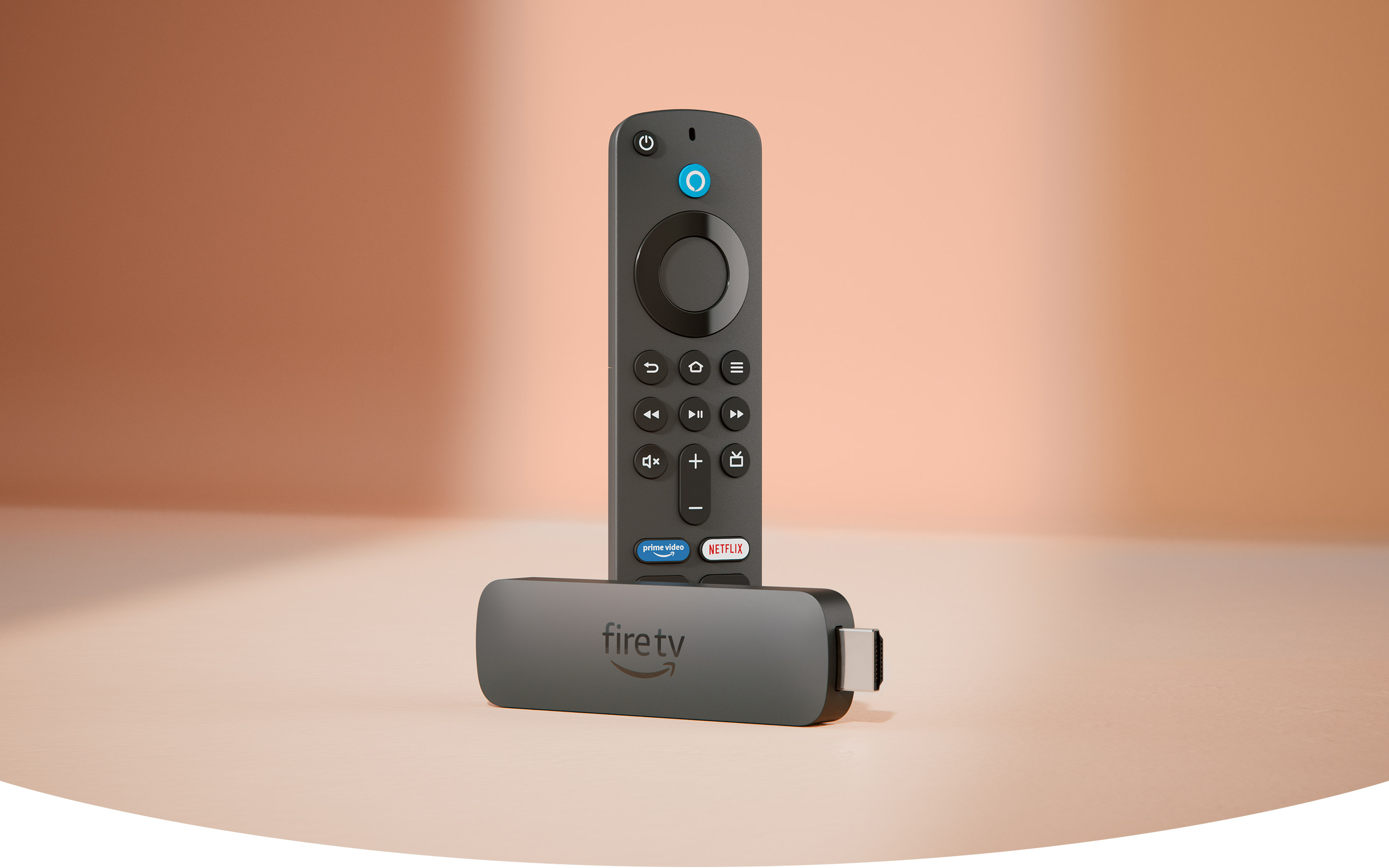 Fire TV Stick 4K: Candy bar-shaped device with an HDMI connector on one end and a USB-C socket on the side, with Fire TV Alexa Voice Remote: with a navigation ring and buttons on the front and a rounded back.
